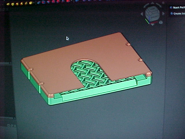A grainy picture of my computer monitor showing the CAD model for the whole wallet